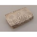 A 19th century oblong 800 silver pill or snuff box of oblong form with embossed cupids in a