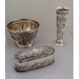 A Victorian silver oblong box with hinged cover with elaborate embossed rococo decoration by Charles