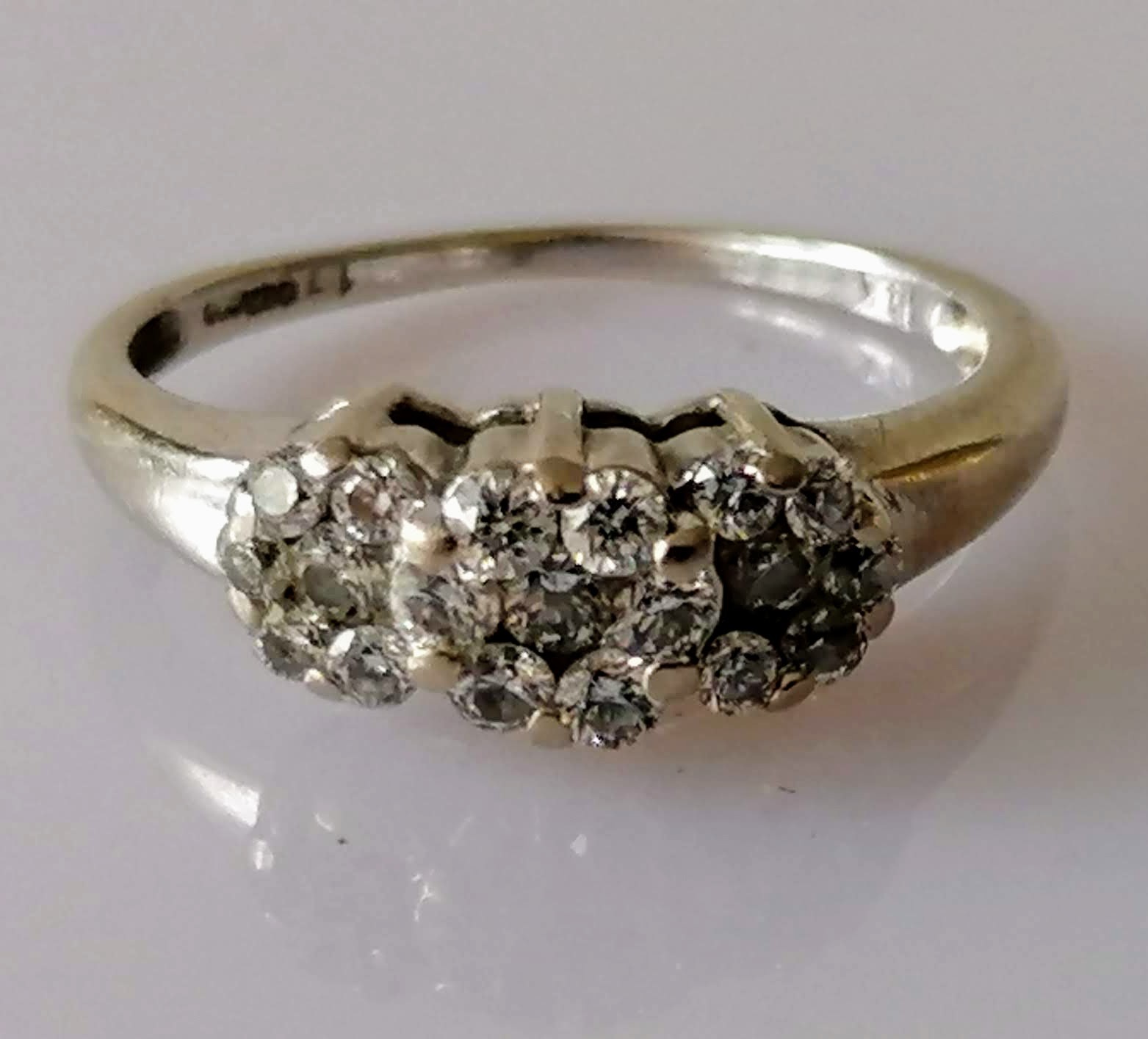 A three-cluster graduated diamond ring in a white gold claw setting; three gem-set yellow gold dress - Image 2 of 5