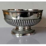 An Edwardian silver rose bowl with half-fluted decoration on a raised foot by Mappin & Webb,