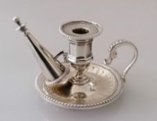 A Victorian silver smaller chamber candlestick with conforming snuffer with beaded decoration on a