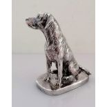 A silver model of a seated Labrador on an oblong base, signed Donaldson, 10.5 cm H, weighted,