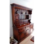 A Royal Oak Furniture Company Balmoral range dresser with shaped cornice, three frieze drawers and
