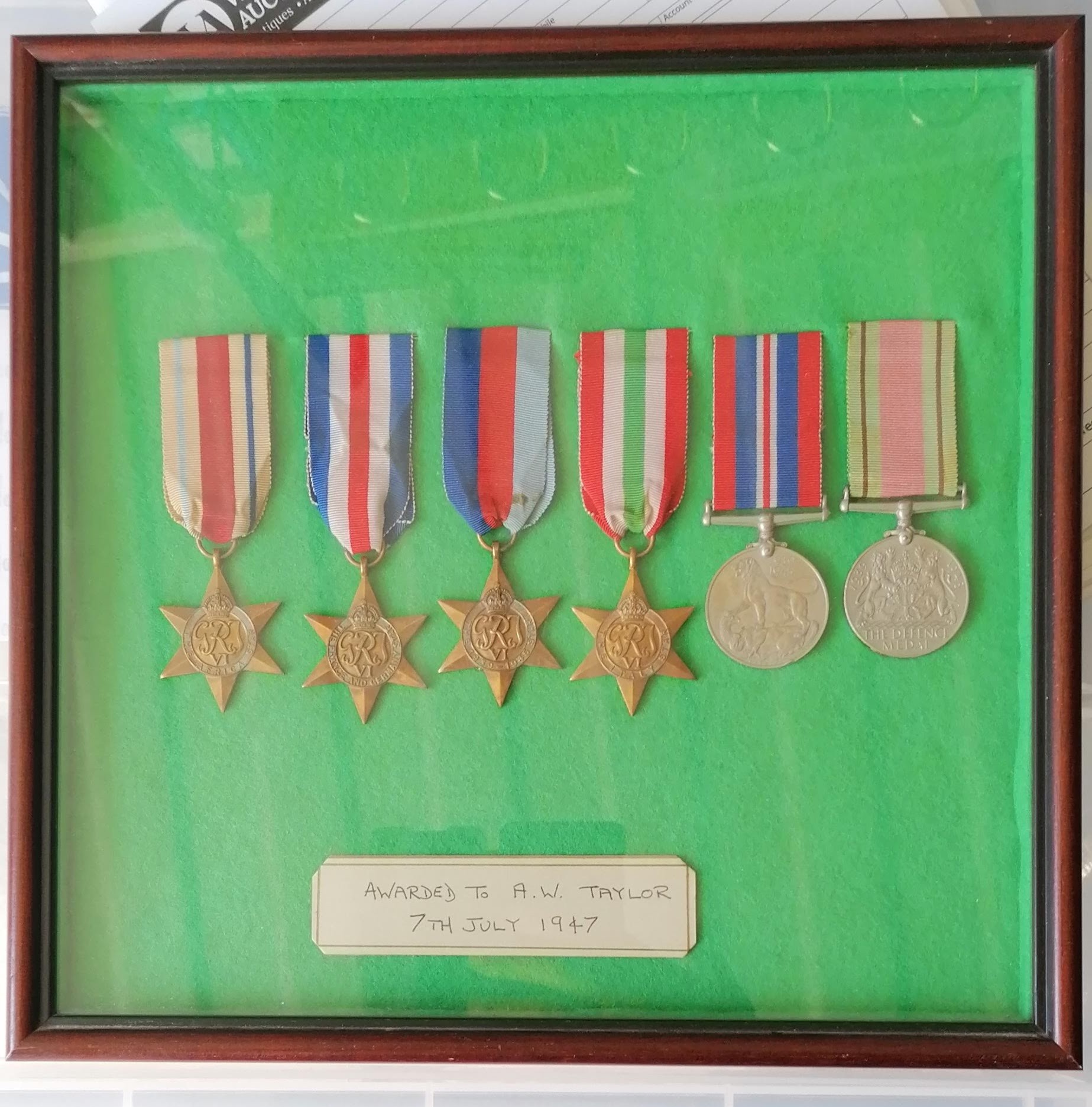 A WW2 cased medal group awarded to A. W. Taylor to include the Africa Star and Italy Star (6)