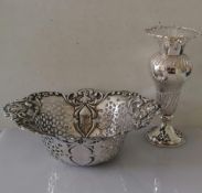 An Edwardian oval silver pierced basket with C-scroll decoration in relief by William Adams Ltd,