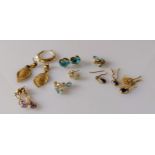 Five and a half pairs of earrings, two more with matching pendants, most gem-set, all stamped/