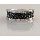 An 18ct white gold half-hoop eternity ring with pave-set white and black diamonds, size N1/2,