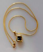 An 18ct yellow gold pendant with four square-cut sapphires with a conforming chain, 38 cm, import