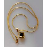 An 18ct yellow gold pendant with four square-cut sapphires with a conforming chain, 38 cm, import