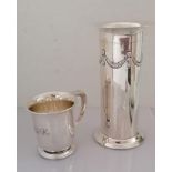 An Edwardian silver cylindrical vase with swag decoration in relief on a raised base by Roberts &