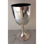 An Edwardian silver chalice or cup of plain form with beaded decoration and knop on a spreading foot