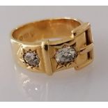 A Victorian 18ct gold buckle ring with two old mine-cut diamonds, approximately 0.50 carats (