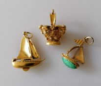 Three Italian gold charms or pendants, two gem-set, largest 33mm, two stamped 750, one tests for