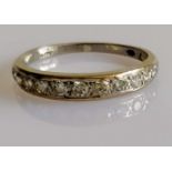 A white gold and diamond half-hoop eternity ring, size O, 2.63g