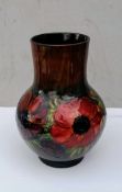A Moorcroft Anemone pattern vase of shouldered bulbous form, green and teal ground, impressed
