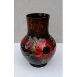 A Moorcroft Anemone pattern vase of shouldered bulbous form, green and teal ground, impressed