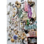 A large assortment of costume jewellery to include necklaces, brooches, rings, watches, etc.