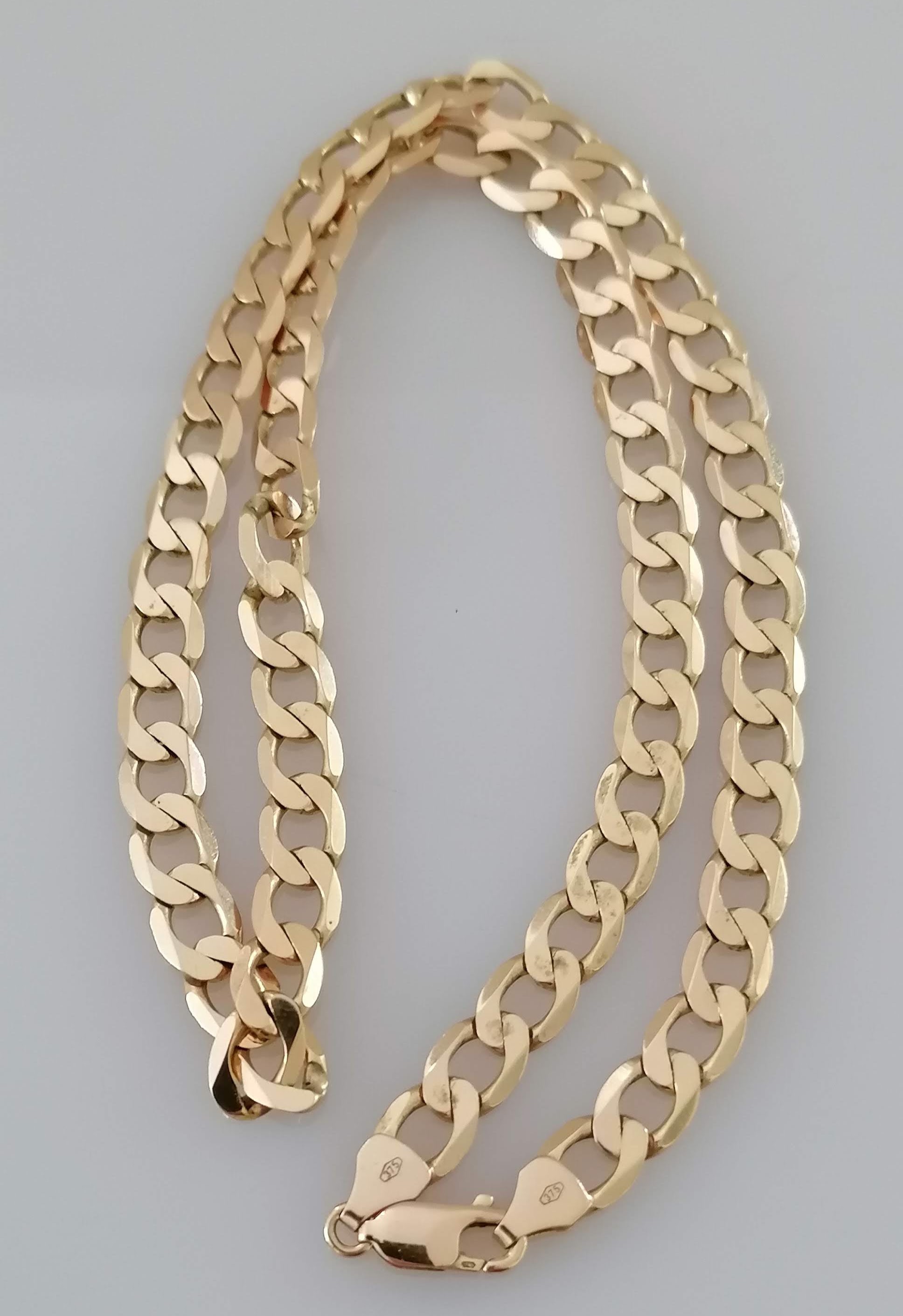 A 9ct yellow gold flat curb-link necklace with lobster clasp, import hallmarks, 46 cm, 30g