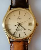 A 1980's gold plated Omega Seamaster Quartz watch with gold coloured round dial, gold markers/hands,