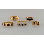 A selection of four gold gem-set rings and one other, smallest J, largest M, all hallmarked or