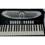 A Giulietti Classic 57 full-sized cased accordion, 41 keys, in seemingly good working order