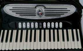 A Giulietti Classic 57 full-sized cased accordion, 41 keys, in seemingly good working order