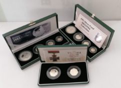 A Royal Mint 1997 and 2005 Silver Proof four-coin Britannia Collection and a Royal Mint Victoria