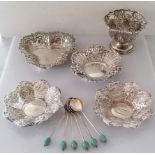 A pair of late Victorian silver pierced bon-bon dishes with profuse rococo vine decoration in relief