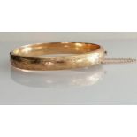 A mid-century 9ct yellow gold bangle with etched decoration, inscription to inside, import marks,