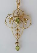 An Edwardian peridot and seed pearl brooch on a 9ct gold frame, stamped, 55mm x 30mm, fitted also as