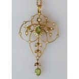 An Edwardian peridot and seed pearl brooch on a 9ct gold frame, stamped, 55mm x 30mm, fitted also as