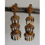 A pair of Oriental-style gold tassel screw-back earrings with fine filigree design, each 55mm