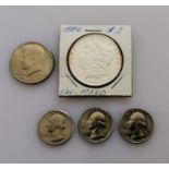 An 1886 Morgan one dollar coin, graded MS-60; three 1776-1976 quarter dollar coins, Denver mint