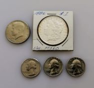 An 1886 Morgan one dollar coin, graded MS-60; three 1776-1976 quarter dollar coins, Denver mint