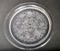 A Lalique France circular dish with floral decoration, etched signature to base, 37 cm diameter,