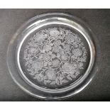 A Lalique France circular dish with floral decoration, etched signature to base, 37 cm diameter,