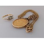A Victorian gold full sovereign, 1872, on a hallmarked 9ct gold mount and chain, 13.9g and a 18ct
