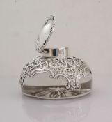 A Victorian silver-mounted crystal glass ink well, the domed body and lid applied with a C-scroll