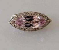 A kunzite and diamond dress ring, the horizontal set marquise-cut kunzite 16.5 x 7.08 x 5.5mm,