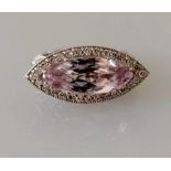 A kunzite and diamond dress ring, the horizontal set marquise-cut kunzite 16.5 x 7.08 x 5.5mm,