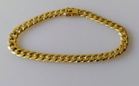 A yellow gold flat curb-link bracelet with box clasp, 29 cm, stamped 750, 23.65g
