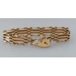 A 9ct yellow gold gate-link bracelet with padlock clasp, hallmarked, 10g