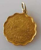 A gold 9950 ¼ Tola Habib Bank coin, fitted as a pendant, 3.14g