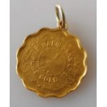 A gold 9950 ¼ Tola Habib Bank coin, fitted as a pendant, 3.14g