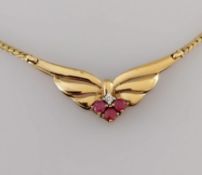 A 9ct yellow gold butterfly-shape pendant with ruby and diamond decoration on an integrated