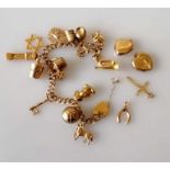 A 9ct yellow gold charm bracelet with four extra charms, all hallmarked, 25.5g