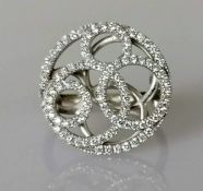 A De Beers cluster ring, swirl design set set with ninety-five round brilliant-cut diamonds, weighin