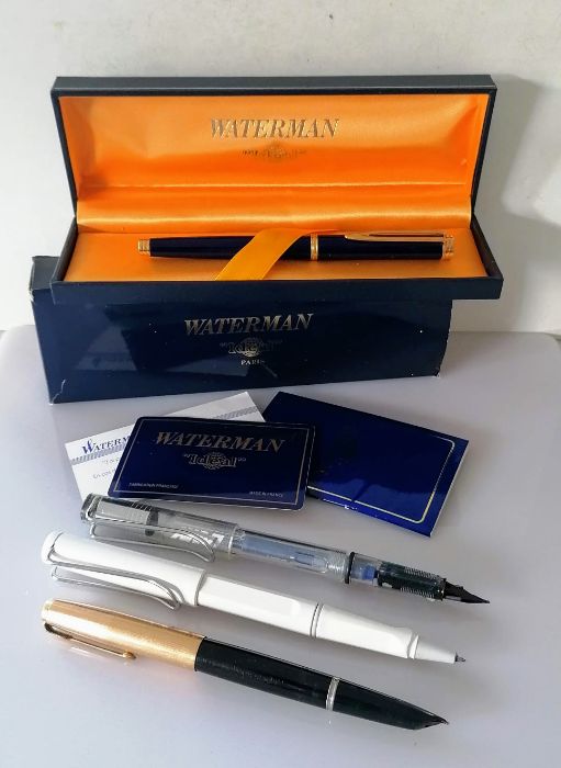 A Waterman Ideal fountain pen with 18k 750 nib, original box and guarantee, two Lamy pens and a Park