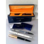 A Waterman Ideal fountain pen with 18k 750 nib, original box and guarantee, two Lamy pens and a Park