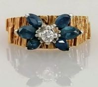 A mid-century gold, diamond and sapphire ring witt textured shank, size L, unmarked